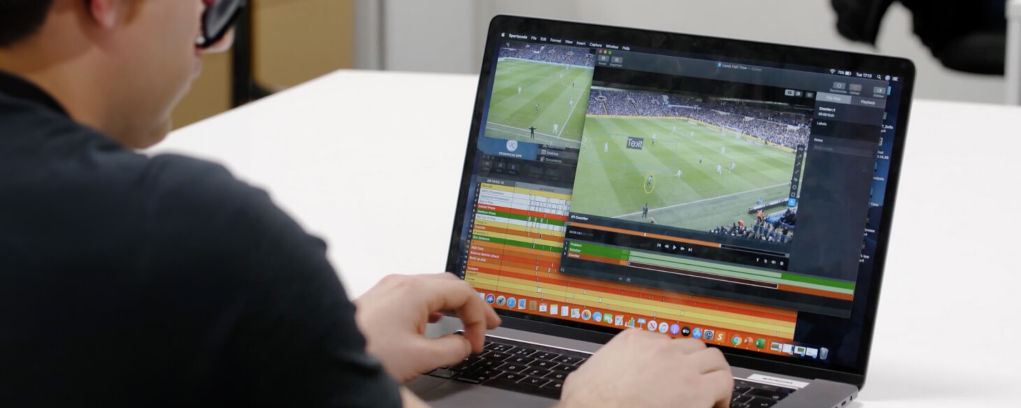 Over the shoulder image of a performance analyst reviewing Multi-Cam soccer footage in Hudl Sportscode